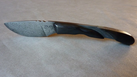 First damascus blade(15N20/o2),quenching oil, buffalo horn handle.
