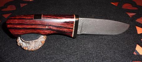 Damascus knife 15N20/o2, quenching oil, cocobolo wood handle, buffalo horn guard , brass and red inserts